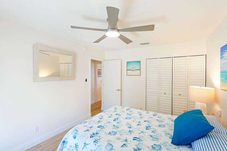 Queen bedroom opens to sunny deck | Siesta Key 1BR