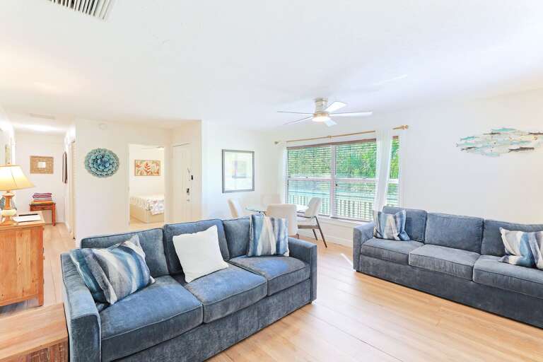 Living Room Interior With Two Sofas And Sliding Door To Balcony