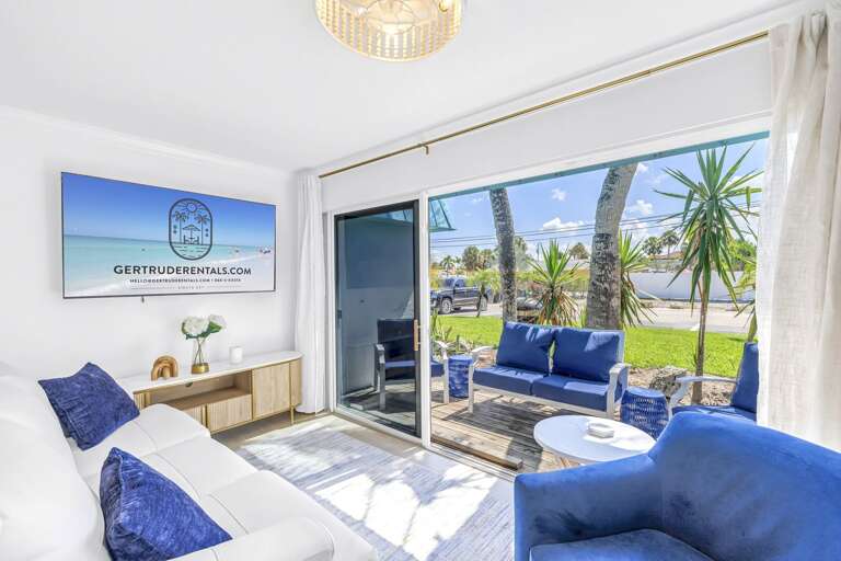 Bright 4-bedroom home steps from Siesta Key Beach and Village restaurants. Includes open living space and private outdoor seating.