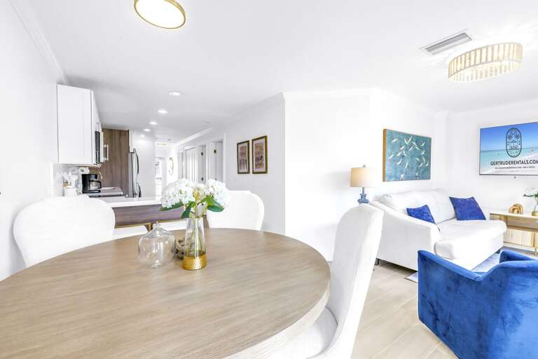 Enjoy a bright open-plan dining and living space in this 4-bedroom Siesta Key Village Home.