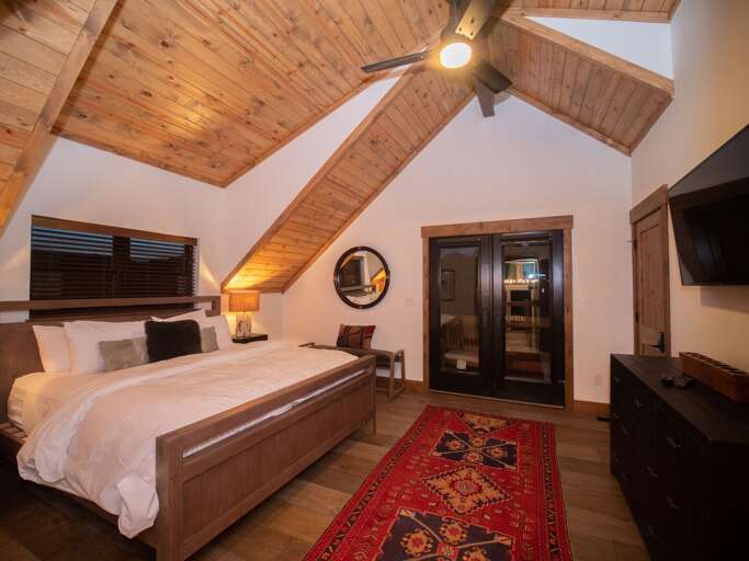 Upper level master bedroom with attached private bathroom