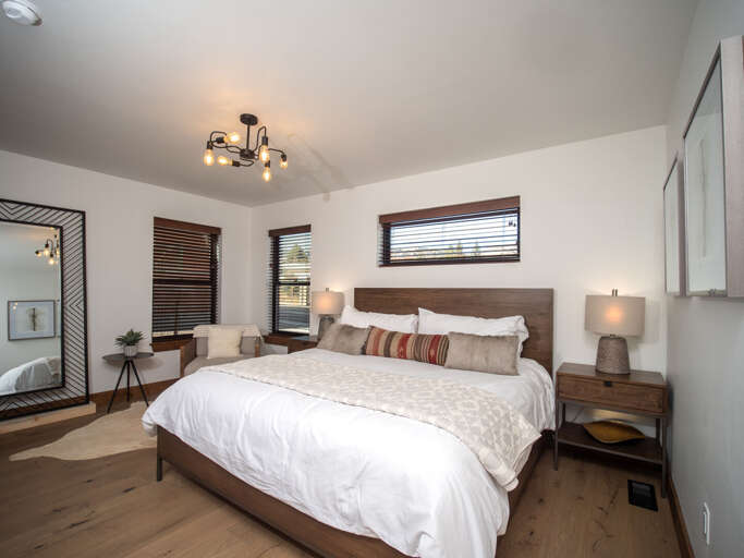 Main level master bedroom with attached private bathroom