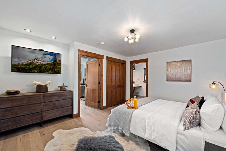 Main level master bedroom with attached private master bathroom