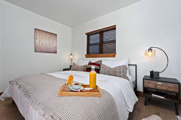 Main level master bedroom with attached private master bathroom