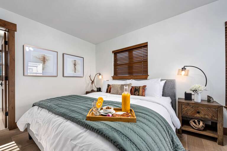 Main level master bedroom with attached private bathroom