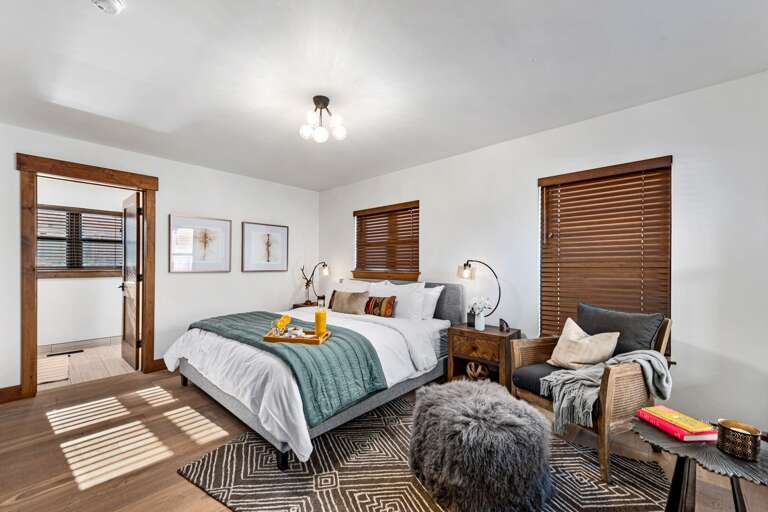 Main level master bedroom with attached private bathroom