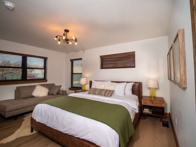 Main level master bedroom with attached private bathroom Main level master bedroom with attached private bathroom