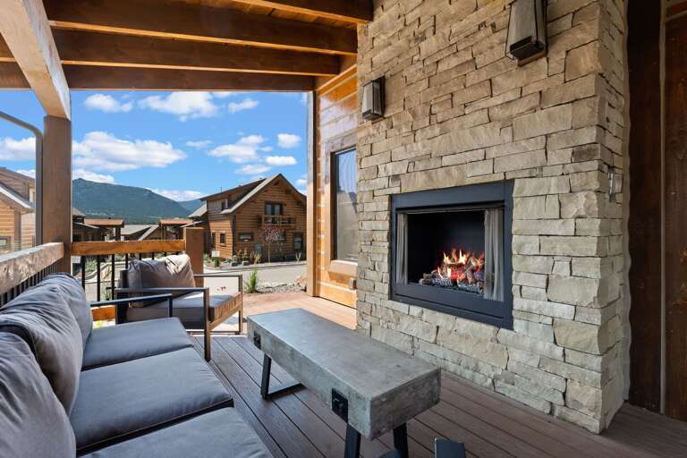 Outdoor patio with fireplace and private jacuzzi