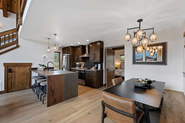 Built in seating at the dining table and gorgeous custom kitchen counter made from live edge walnut and concrete.
