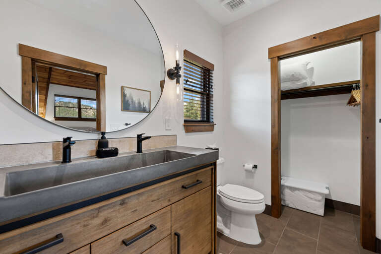 Gorgeous bathroom with custom concrete trough sink