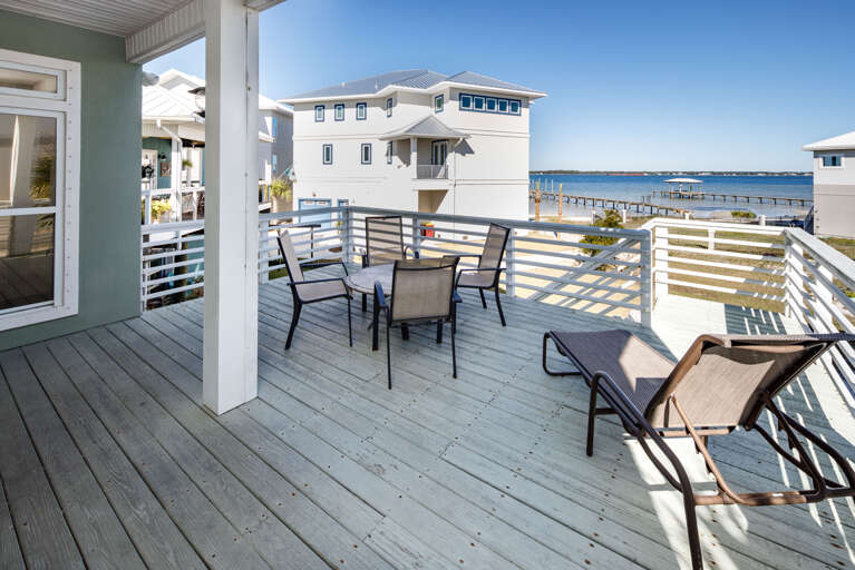 Large deck off of the Living room and kitchen with stairs down to the back yard