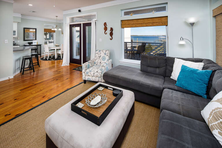 Living room area with large deck and bay views (First level of the home)