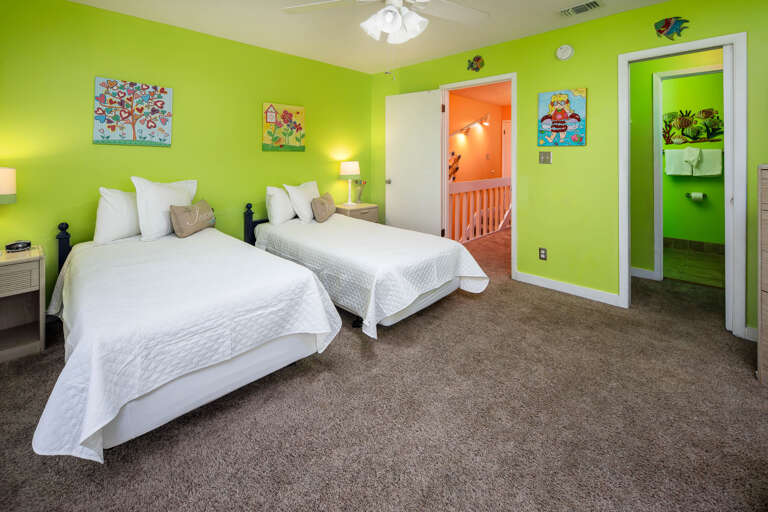 Second bedroom with twin size beds and bathroom