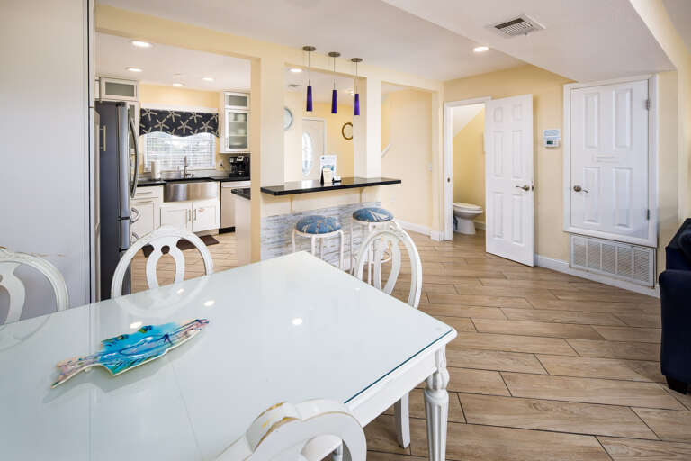 Kitchen and dining area off of living room with half bath downstairs