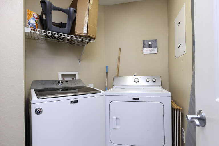 Laundry room with full size washer and dryer