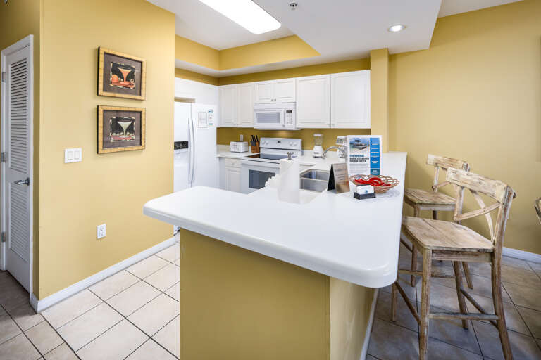 Fully stocked kitchen with breakfast bar