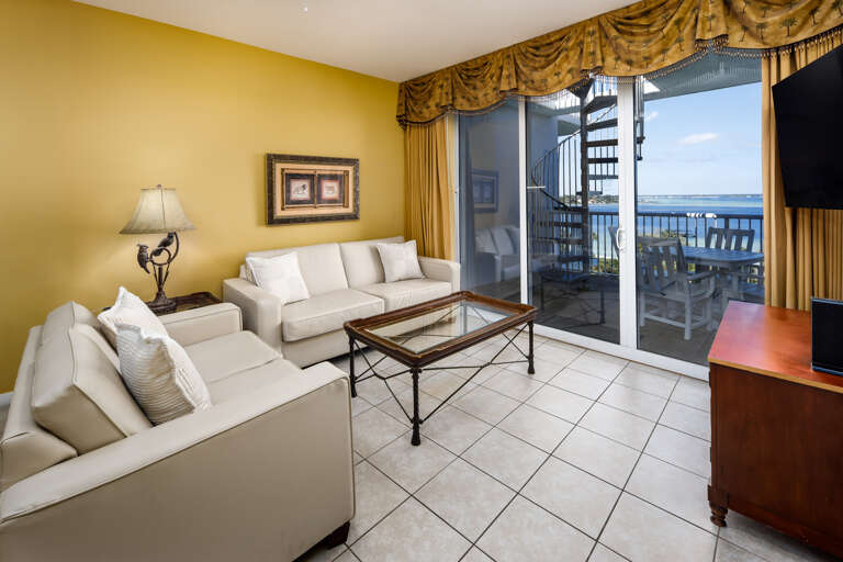 Living room with balcony accesss and bay views