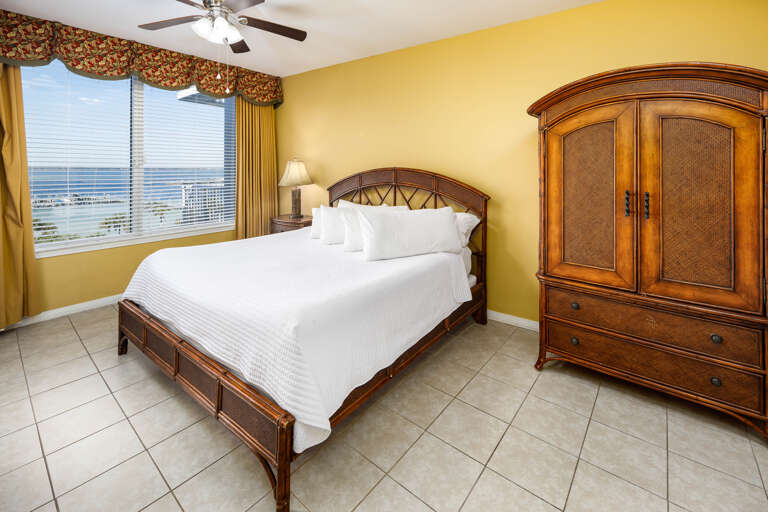 Master bedroom with king size bed and bay views