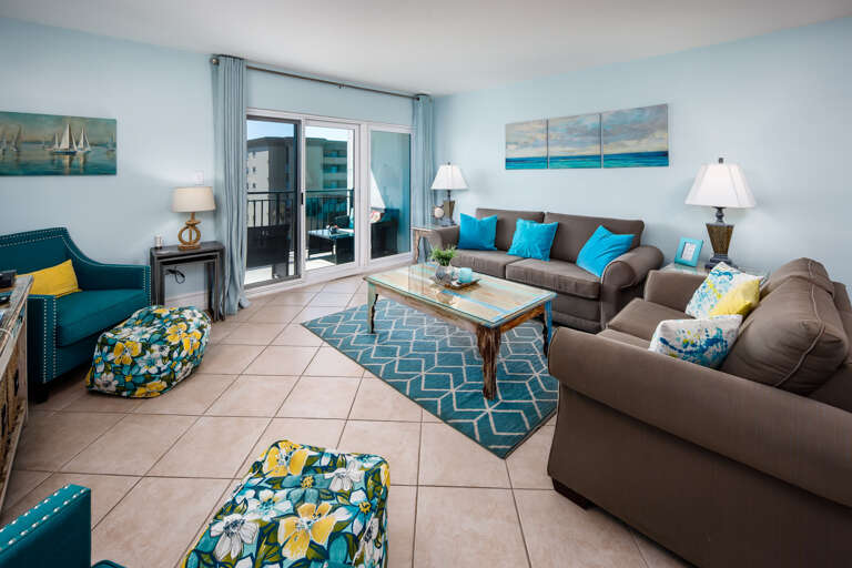 Living room with glass sliders and beach views