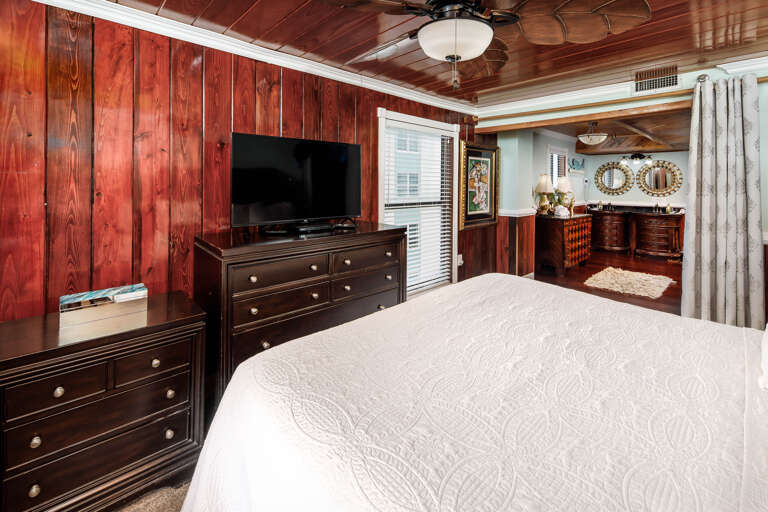 Master bedroom with TV and private bathroom