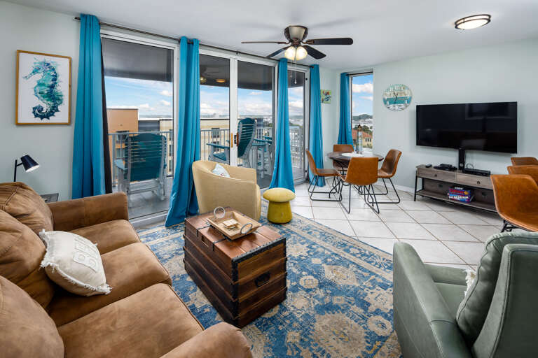 Living room with TV and balcony access