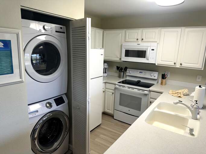 Kitchen with washer and dryer