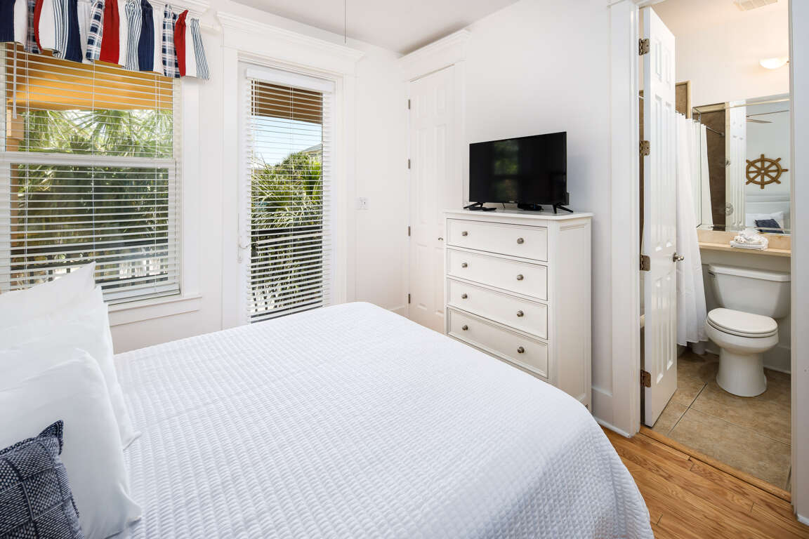Second floor third bedroom with TV and balcony access Second floor third bedroom with TV and balcony access