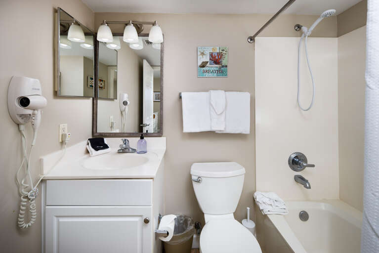 Full size bathroom with shower/tub combo