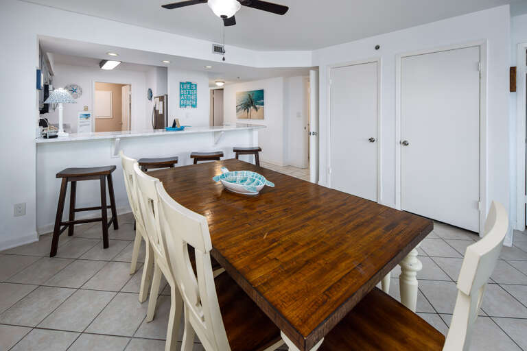 Enjoy a meal together at this spacious dining room table Enjoy a meal together at this spacious dining room table