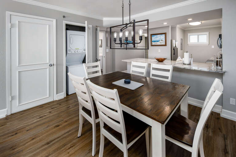Dining table with seating for six and washer and dryer