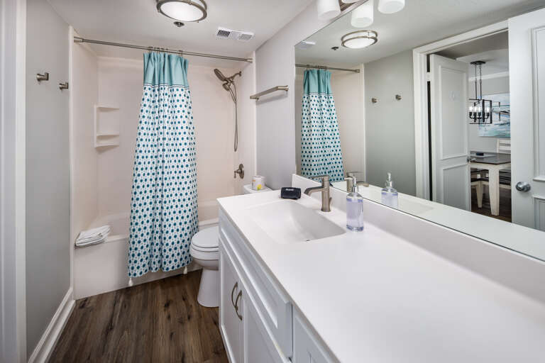 Second full size bathroom with shower/tub combo