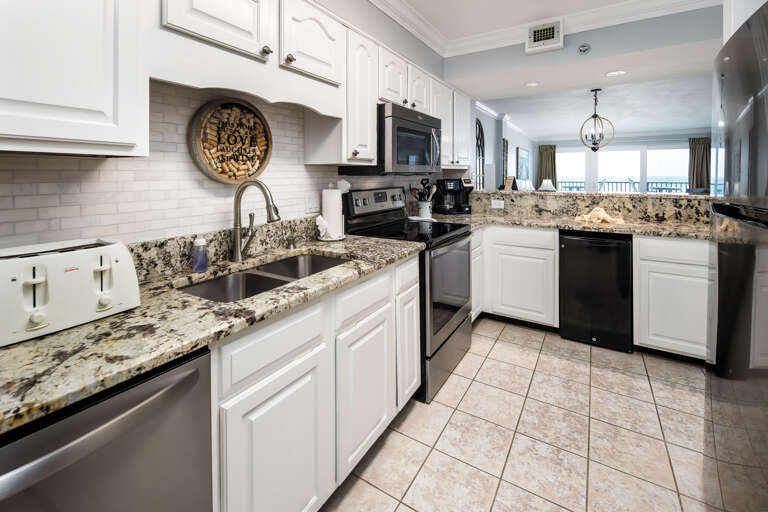 Cook a meal together in the large fully stocked kitchen