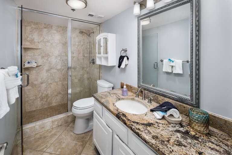 The master bathroom has a walk in shower