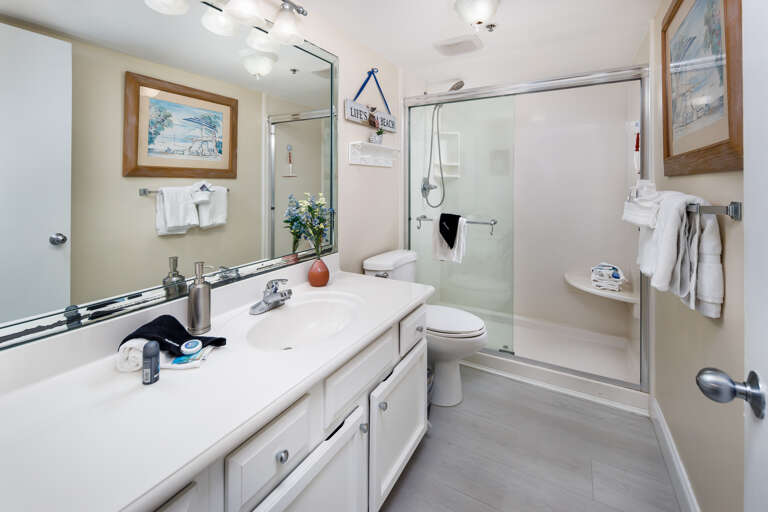 The master bedroom has a large walk in shower with a detachable shower head