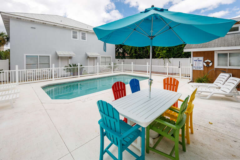 Dining table and grill for outdoor meals on the pool deck