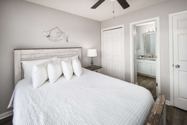 Side A Second bedroom with queen size bed and bathroom