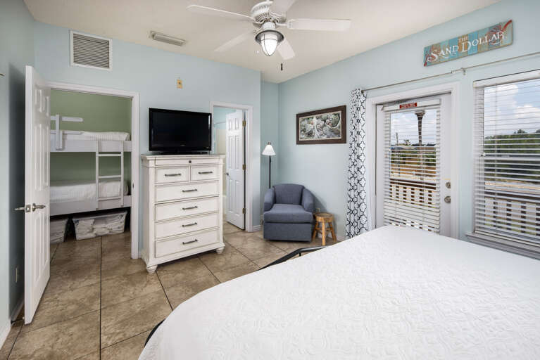 Master bedroom with TV and balcony access Master bedroom with TV and balcony access