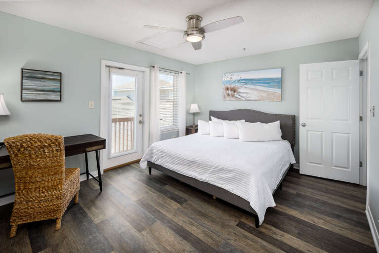 Master bedroom with king size bed and pool views Master bedroom with king size bed and pool views