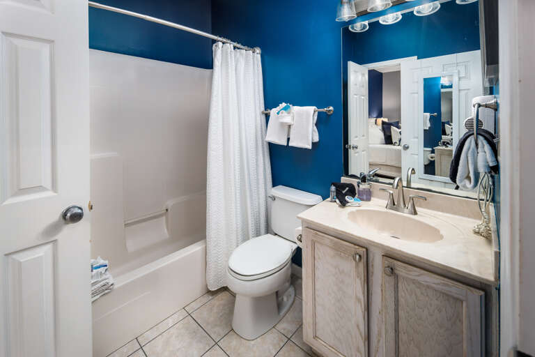 Full size bathroom with shower/tub combo