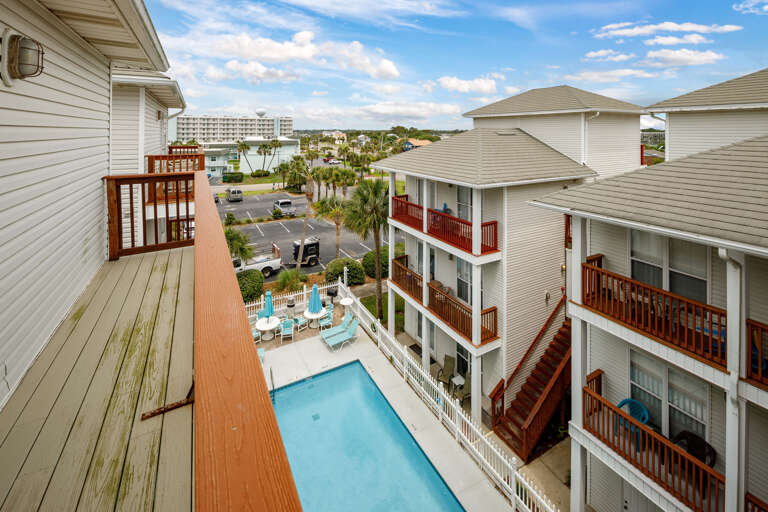Balcony views facing the courtyard pool from the top floor master
