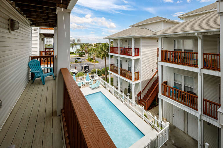 Balcony views facing the courtyard swimming pool from the second bedroom