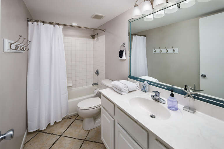 Second full size bathroom with shower/tub combo