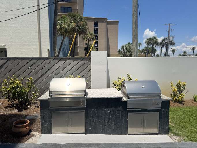 Gas grills in grilling area Gas grills in grilling area