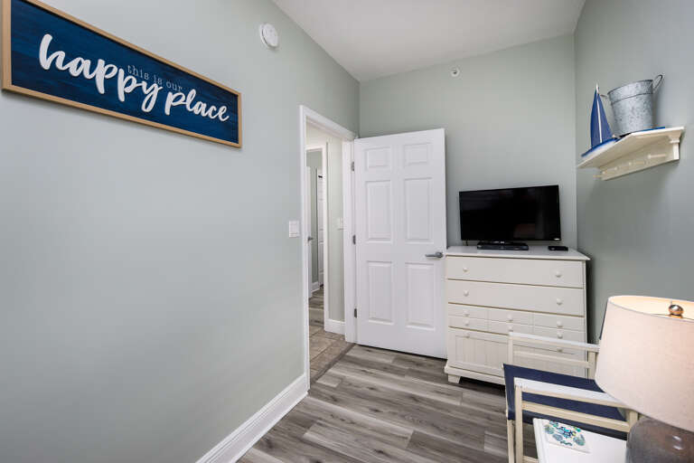 Third bedroom with bunk beds and TV