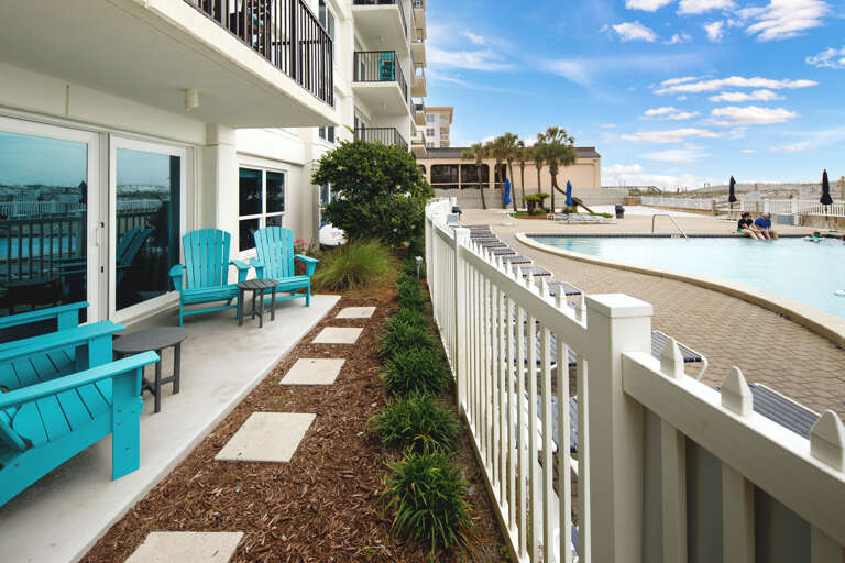 Back porch with pathway to enter the pool deck