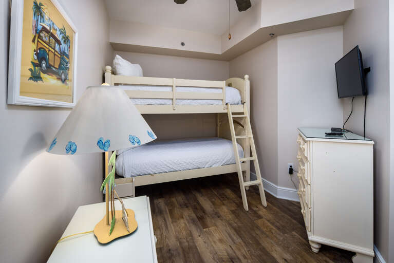 Third bedroom with twin bunks and TV