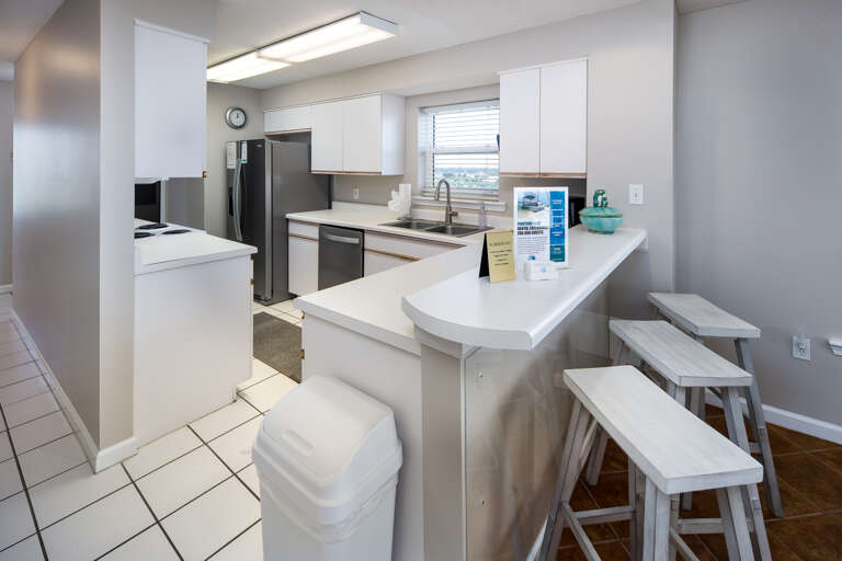 Fully stocked kitchen with breakfast bar
