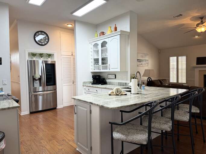 Fully stocked kitchen with breakfast bar