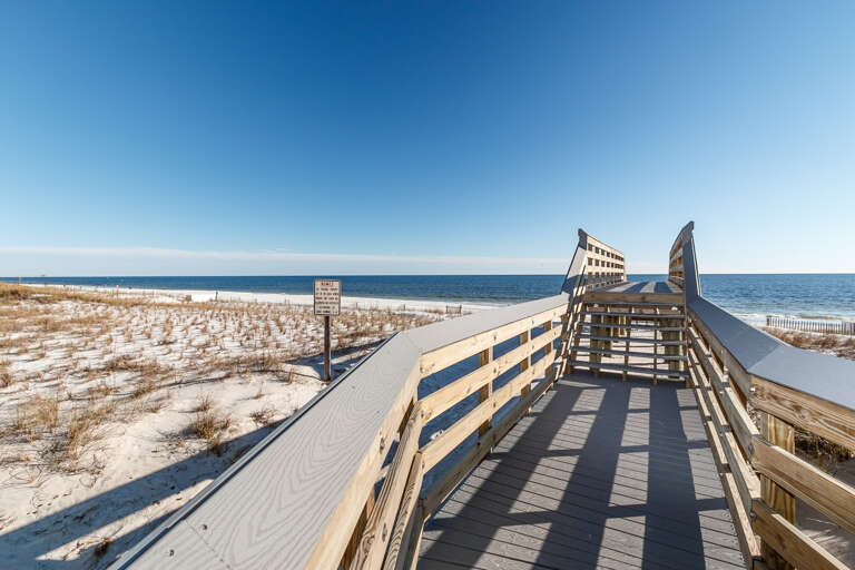 Walk down the short boardwalk to the beach