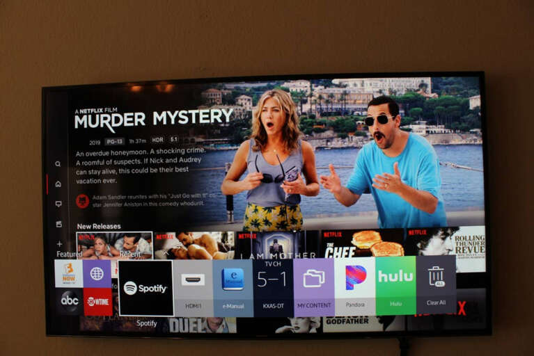 Samsung Smart TV in Living Room with Streaming Services, HD Antenna, Roku, and Bose Sound System.